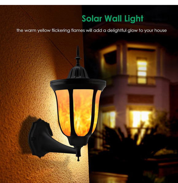 Showing night scene of Solar Dancing Flame Wall Light – 96 LED, Waterproof, Dusk-to-Dawn